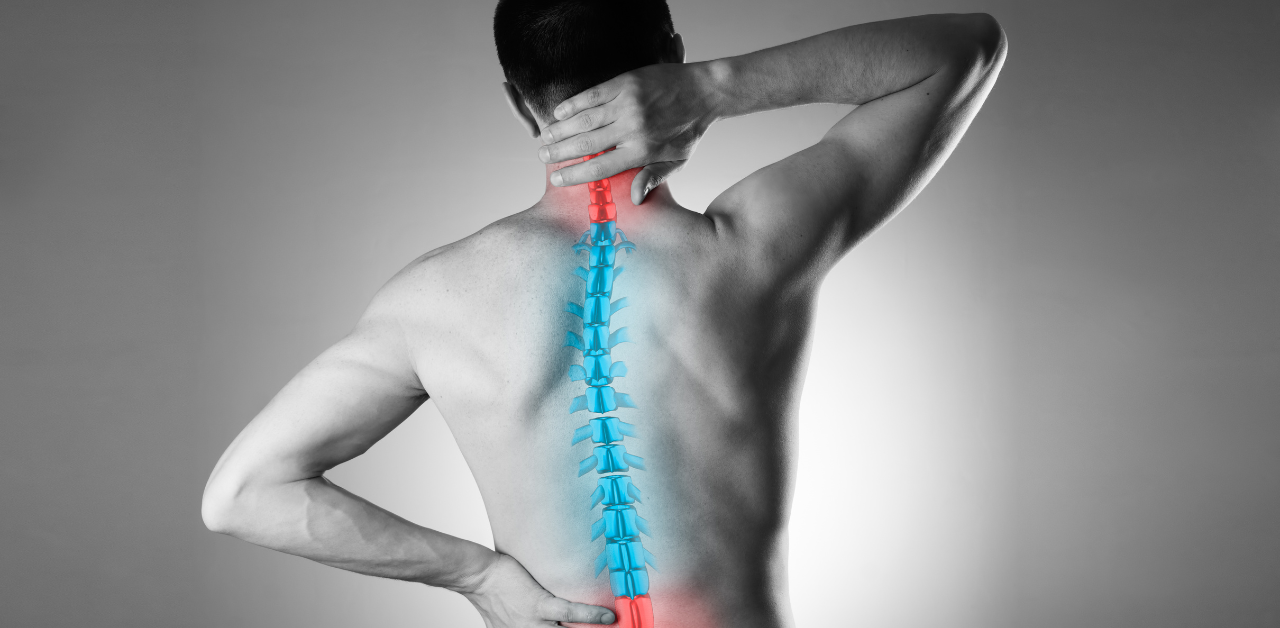 A man with his back turned, holding his neck and lower back, with an illustrated spine highlighted in red and blue, indicating pain in those areas