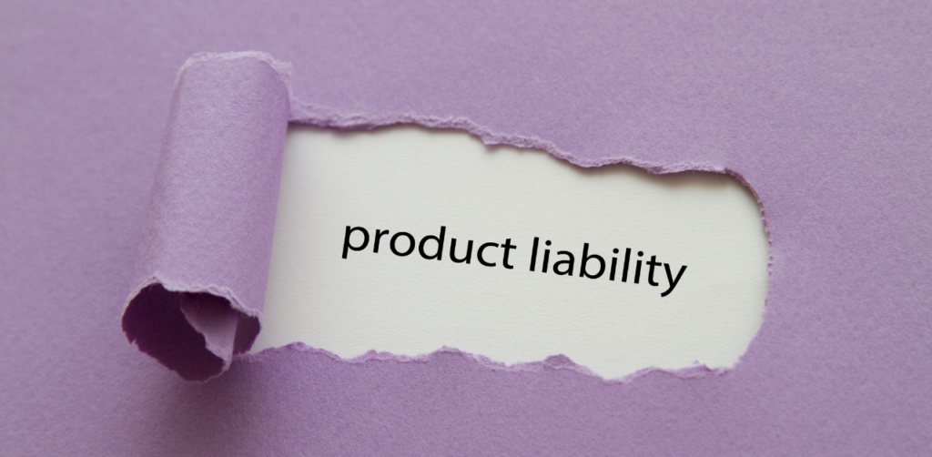 A torn purple paper revealing the words product liability written on a white background, symbolizing legal or business concerns